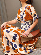 Geometric Print Puff Sleeve Diamond Cutout Twist Waist Maxi Dress