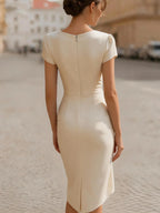 A Midi Dress With A Ruffled Neckline And A Fitted, Bodycon Silhouette.