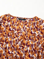 Abstract Print V Neck Smocked Babydoll Blouse