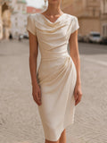 A Midi Dress With A Ruffled Neckline And A Fitted, Bodycon Silhouette.