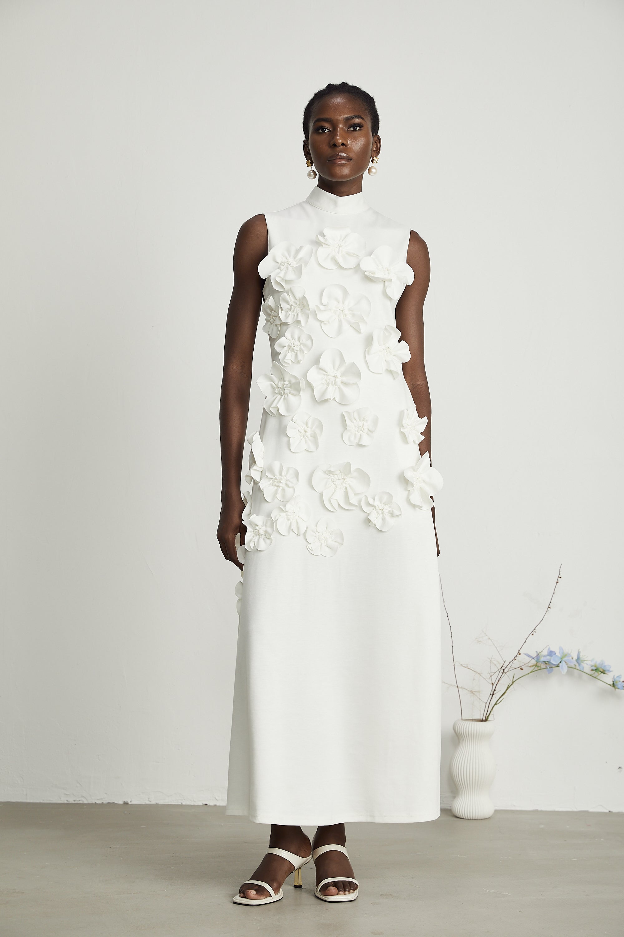 Magali White Sleeveless Maxi Dress with Faux Flower & Bow-Tie Embellishment