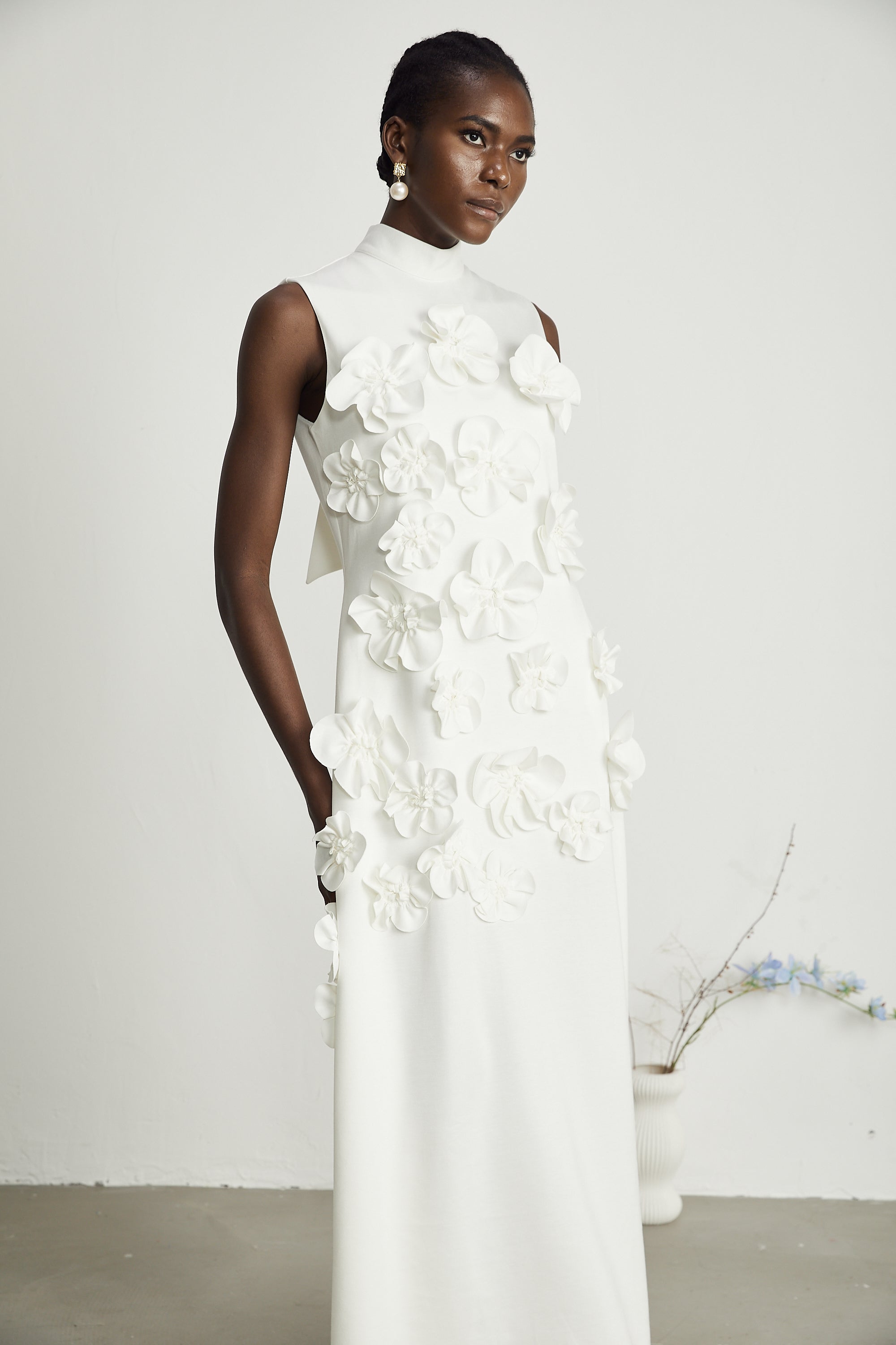 Magali White Sleeveless Maxi Dress with Faux Flower & Bow-Tie Embellishment