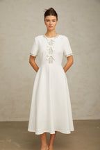 Cassiopeia crystal-accented bow midi dress in White