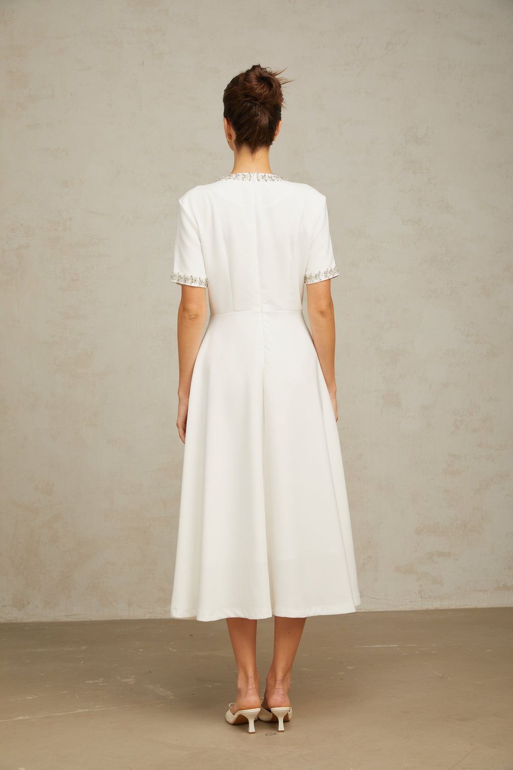 Cassiopeia crystal-accented bow midi dress in White