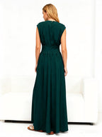 Chic Fitted Emerald Green Gown With Pleated Skirt Perfect For Formal Events