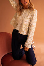 | Short jacket in gold sequined fleece with open front