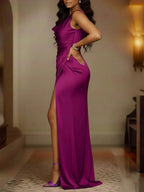 Long Sleeveless Satin Dress With Slits And Pleats At The Hem