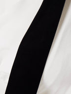 Velvet bow embellished white gown
