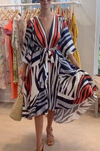 V Neck Lantern Sleeve Tie Waist Printed Irregular Swing Dress