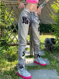 Distressed Patch Decor Slim Jeans