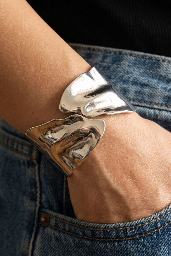 A Stylish and Distinctive Open-style Bracelet Featuring An Irregular, Crisscross Design.