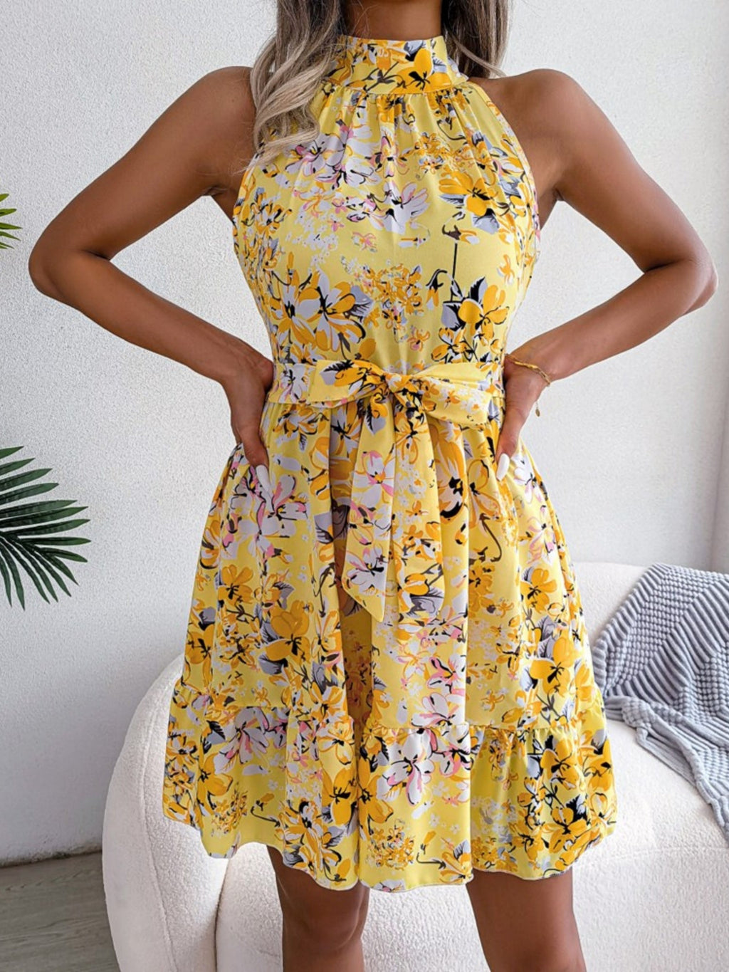 Printed Sleeveless Tie Mini Dress With A Full Skirt