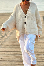 | Solid color loose long sleeve knitted sweater with V-neck and pocket