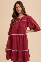 Aaliyah Boutique Tiered Dress with Tassels and Contrast Trim, Tied Neckline, Half Sleeves Designer Edit