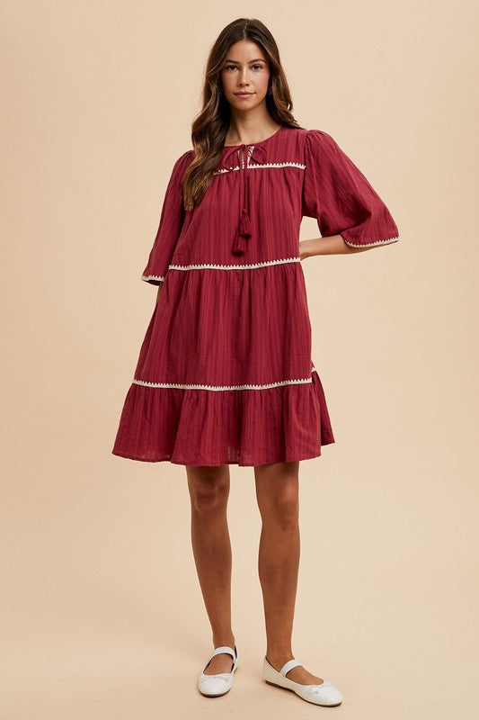 Aaliyah Boutique Tiered Dress with Tassels and Contrast Trim, Tied Neckline, Half Sleeves Designer Edit