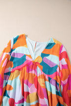 Laura Effortless Long Sleeve Mini Dress with Ruffle Hem and Color Block V Neck Statement Occasion Edit