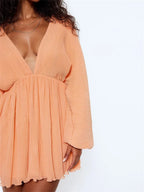 Plissé Deep V-Neck Bell Sleeve Empire Waist Mini Dress