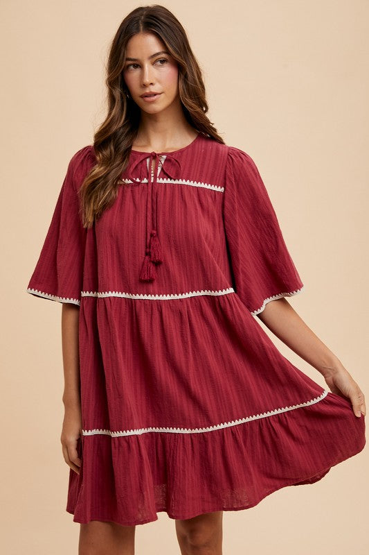 Aaliyah Boutique Tiered Dress with Tassels and Contrast Trim, Tied Neckline, Half Sleeves Designer Edit