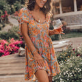Boho Floral Print Puff Sleeve Tie Neck Tassel Ruffle Mini Dress
