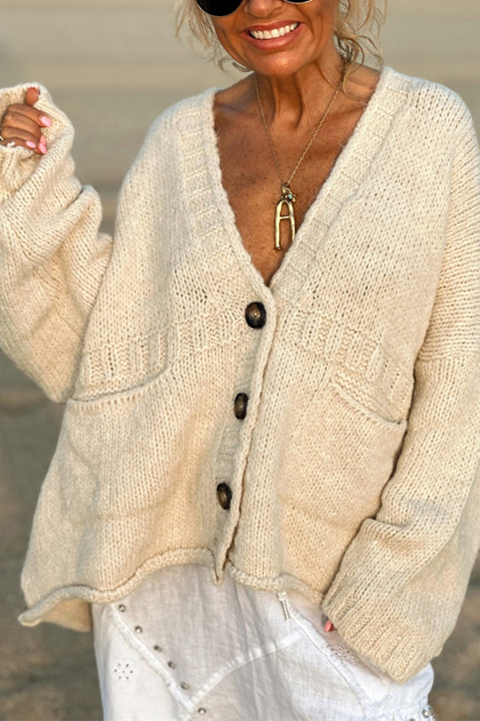 | Solid color loose long sleeve knitted sweater with V-neck and pocket