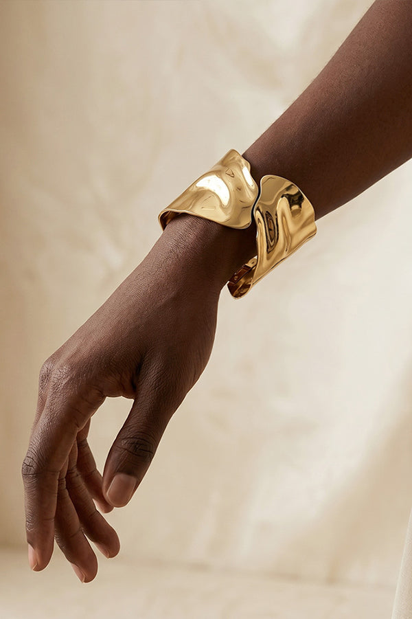A Stylish and Distinctive Open-style Bracelet Featuring An Irregular, Crisscross Design.