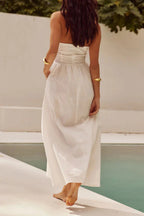 | Sleeveless dress with pocket pleats and halterneck