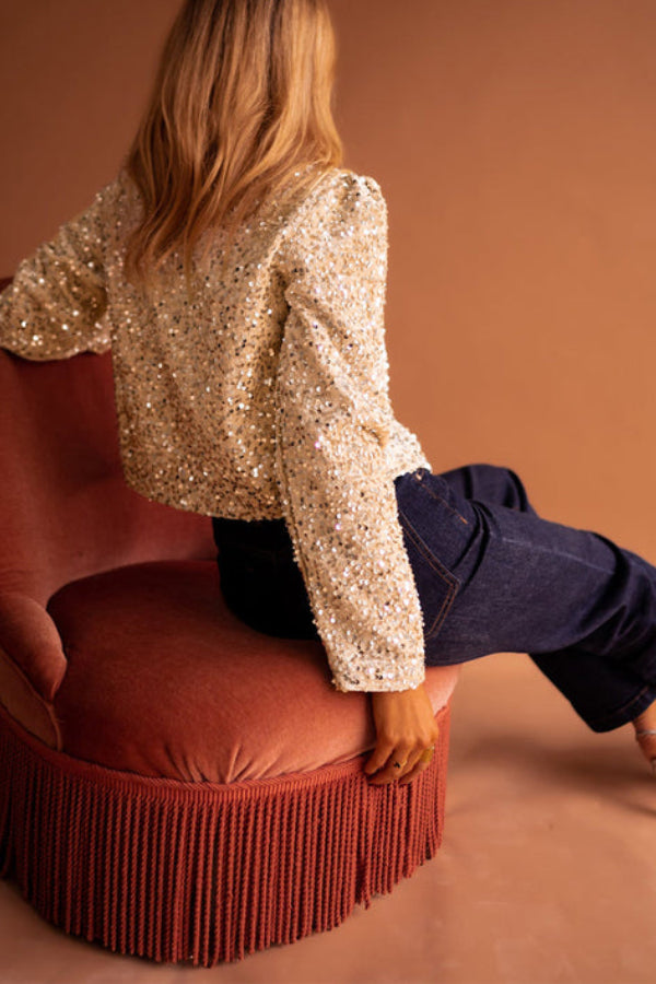 | Short jacket in gold sequined fleece with open front