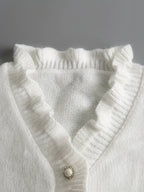 | Ruffle Blouse with Decorative Buttons