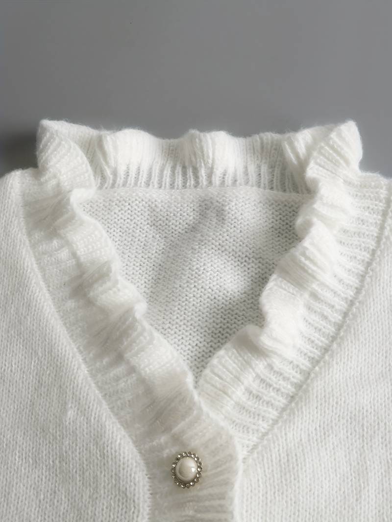 | Ruffle Blouse with Decorative Buttons