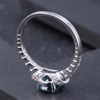 Cubic Zirconia and London Blue Topaz Halo Ring