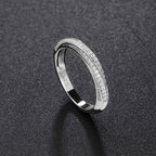 Rhodium Plated Sterling Silver Twisted Ring with Round Cut Moissanite Pave